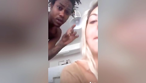 Blonde in tight shorts shows her tattoo on her neck