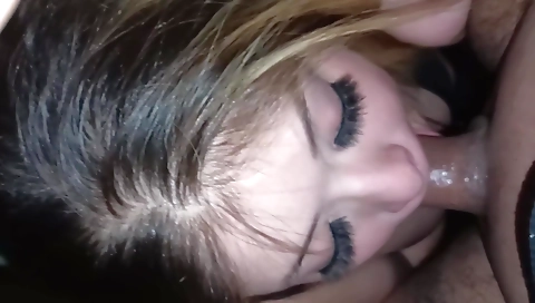 Hairy blonde with a tattooed bush is giving a deep blowjob