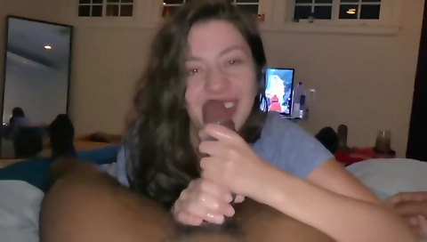 Brunette with a large round ass sucking a big dick