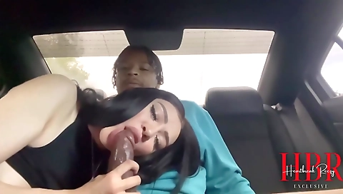 Latina in a sexy outfit in the backseat of her boyfriend