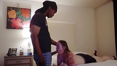 Amateur interracial sex with a redhead with a tattoo